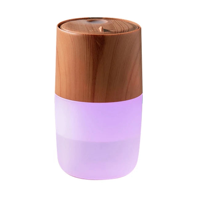 Wooden-top and purple-bottom diffuser on a white background