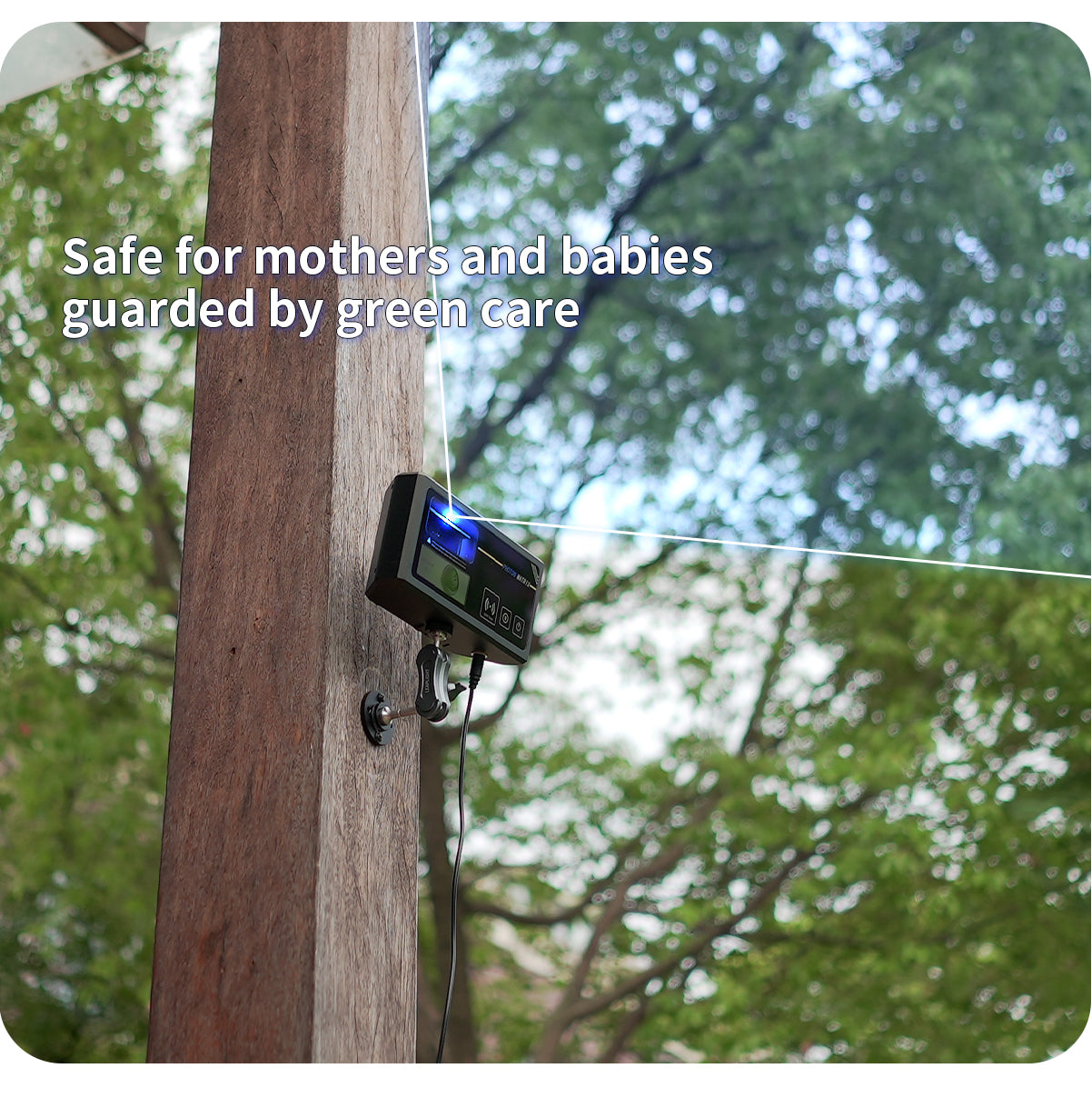 Photon Matrix attached to a wooden post with greenery in the background and text 'Safe for mothers and babies guarded by green care'.