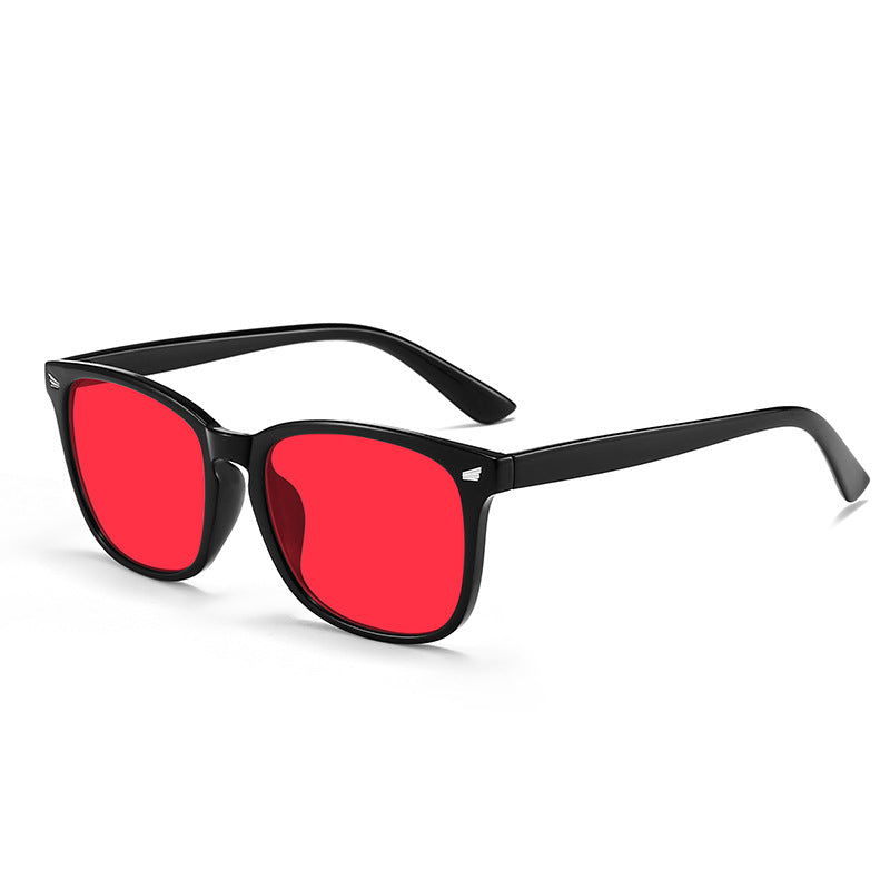 Anti Blue light Glasses with black frame and red lenses on a white background