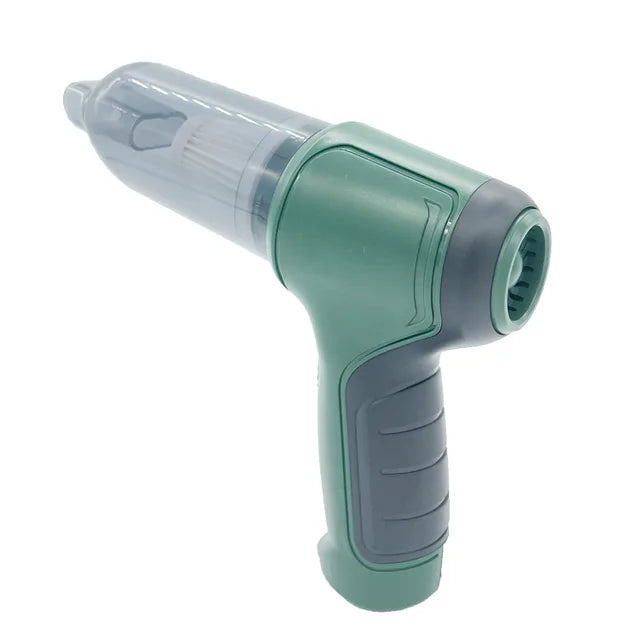 Green and gray handheld mini vacuum cleaner on a white background