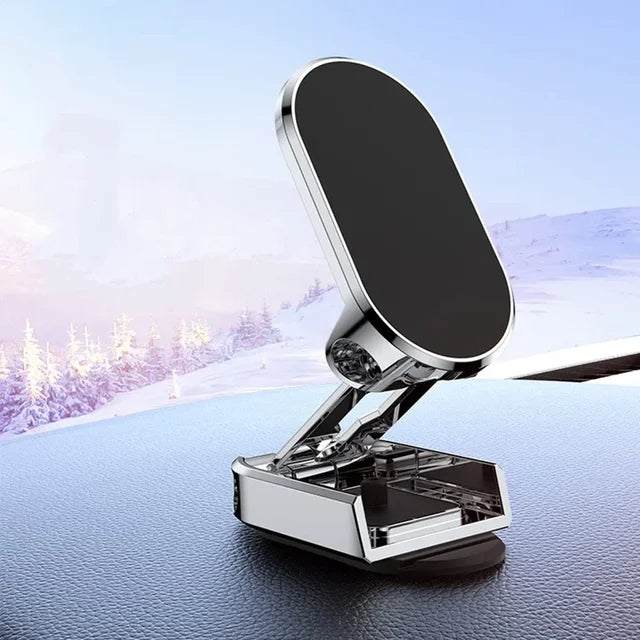Phone holder on a car dashboard with a snowy landscape in the background