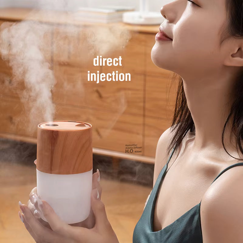 Woman using a humidifier with steam rising, wooden cabinet in the background
