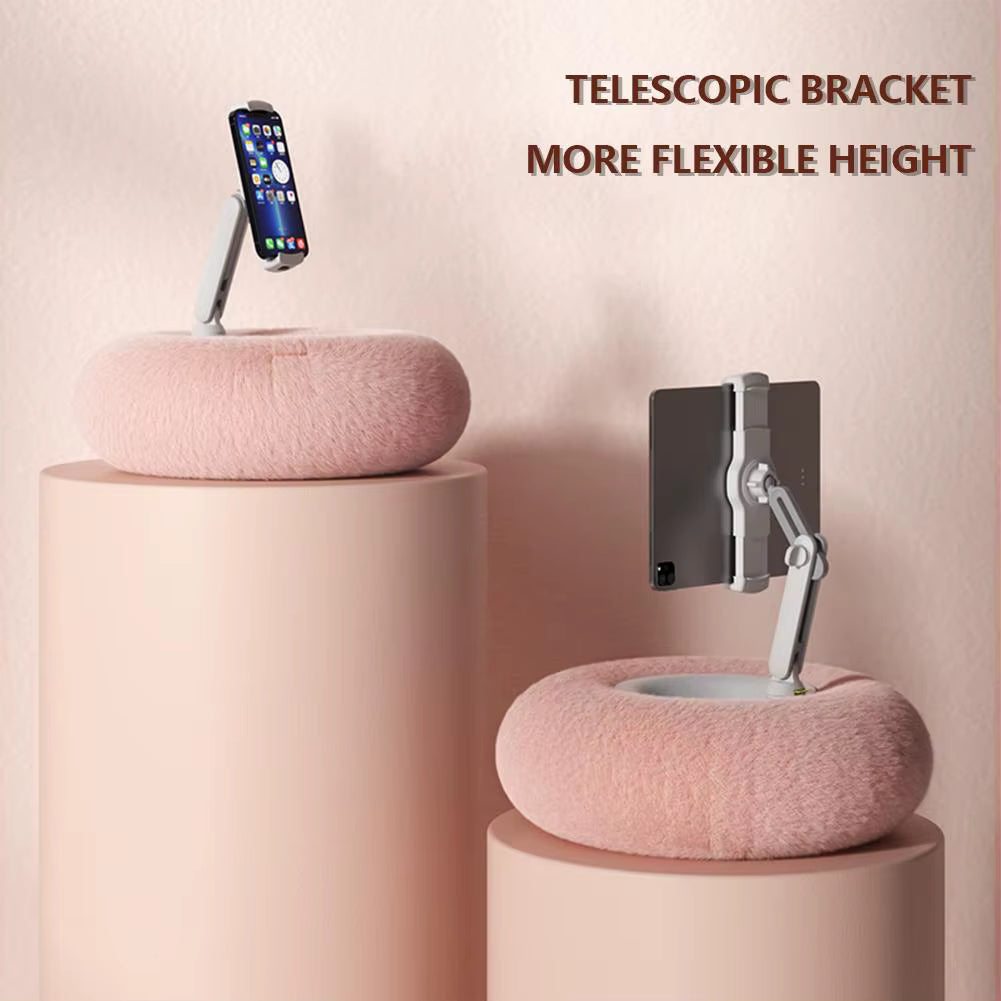Telescopic bracket with adjustable height on pink cylindrical stands against a light pink background.