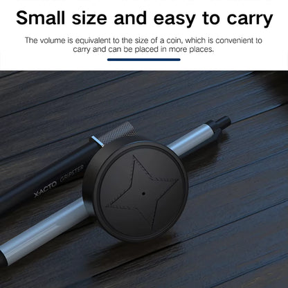 Small black and silver gps device on a wooden surface with text about its size and portability.