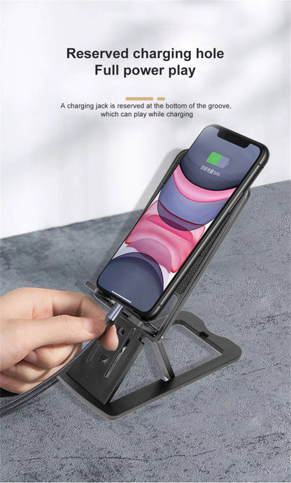 Phone stand with charging feature on a gray surface