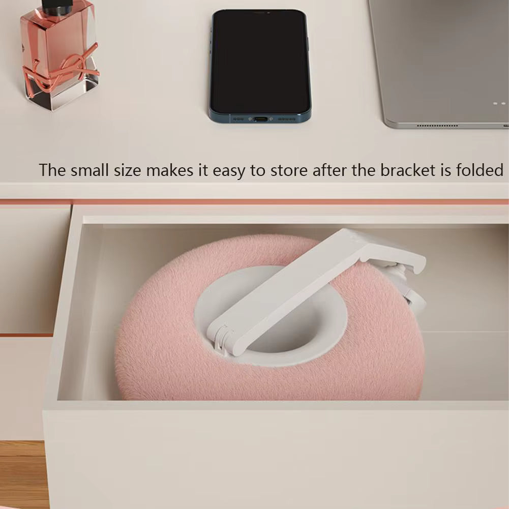 Pink and white product folded into a compact size, stored in a drawer.