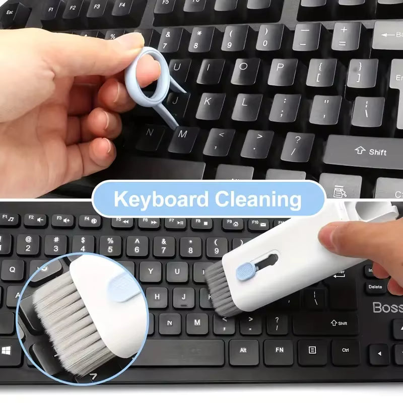Keyboard cleaning tool being used on a keyboard with close-up of brush and cleaning solution.