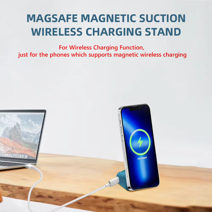 Magsafe magnetic suction wireless charging stand with smartphone and laptop on a wooden surface.