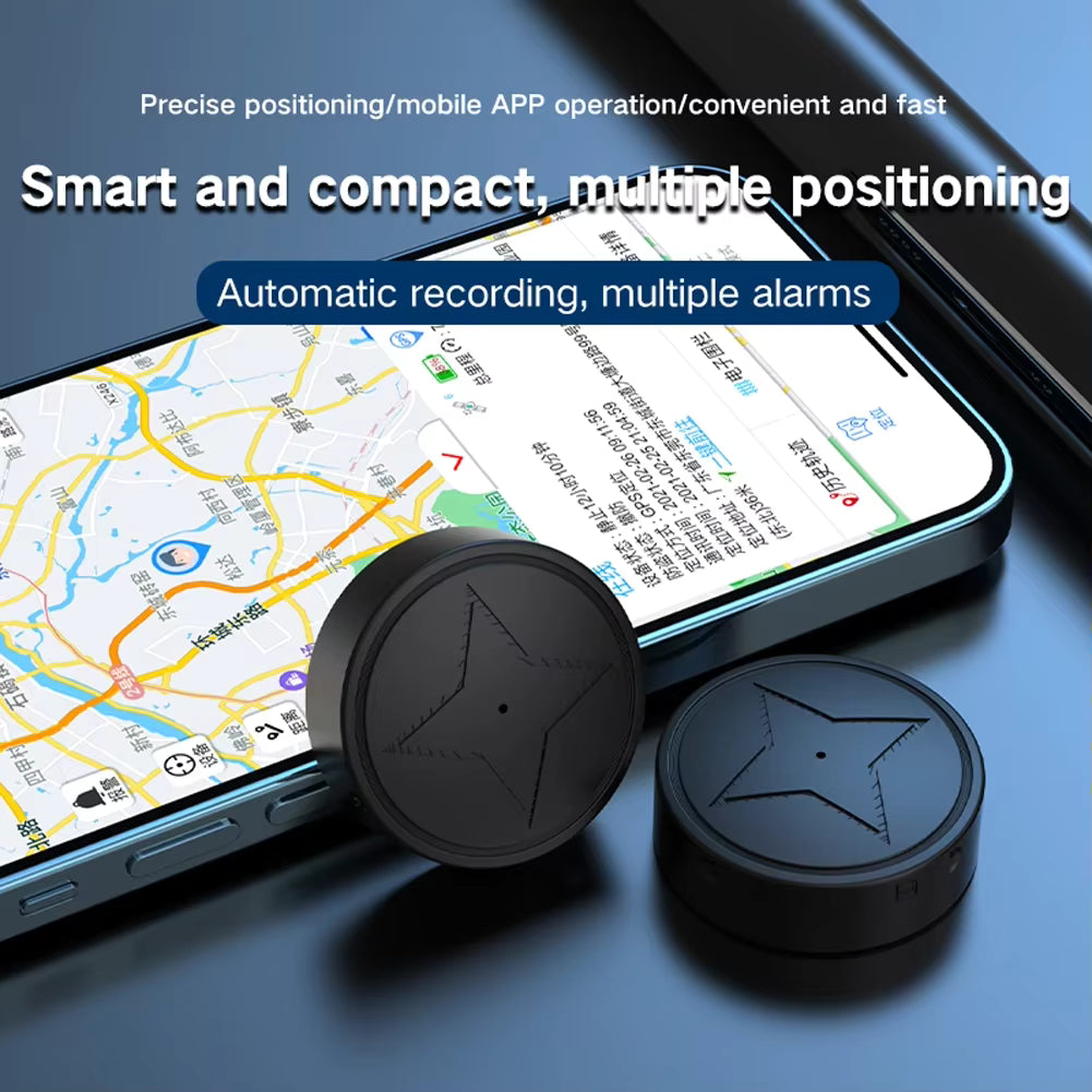Two black round GPS trackers with star patterns on a smartphone displaying a map app.