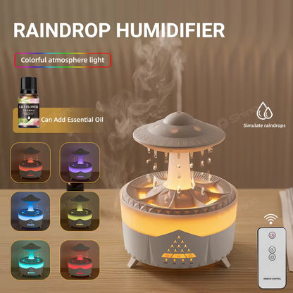 Raindrop humidifier with colorful light effects and essential oil bottle on a wooden surface.