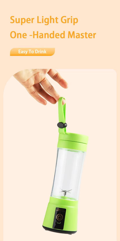 Green portable blender with a hand holding it on a light pink background