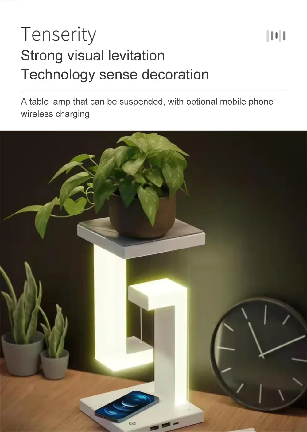 Table lamp with wireless charging pad and plant on a dark background