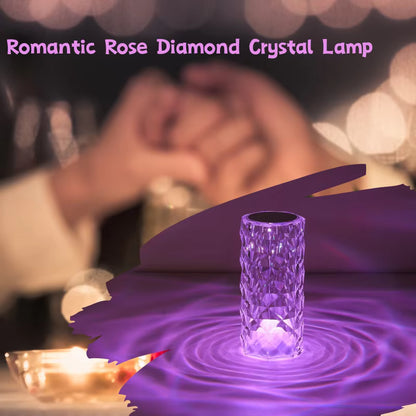 Crystal lamp with purple flower petals and blurred romantic background