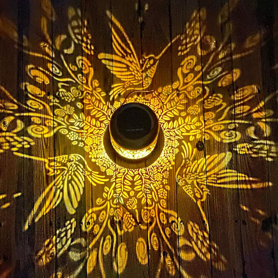 Decorative light fixture with floral patterns on a wooden surface