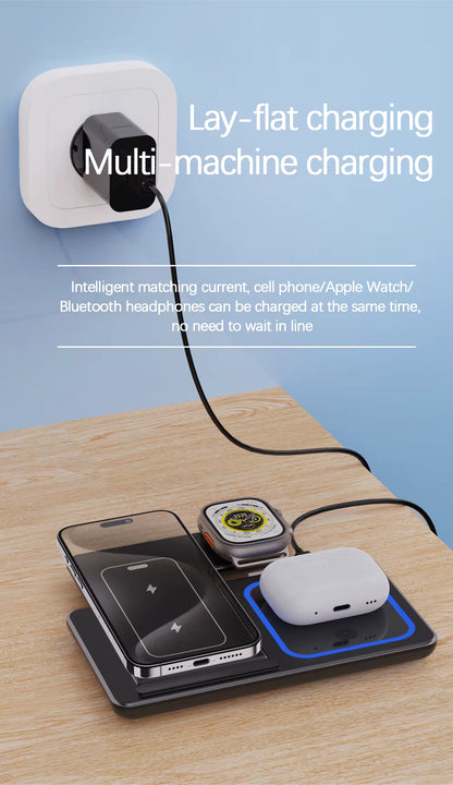 Multi-device charging station with phone, watch, and headphones on a wooden surface.