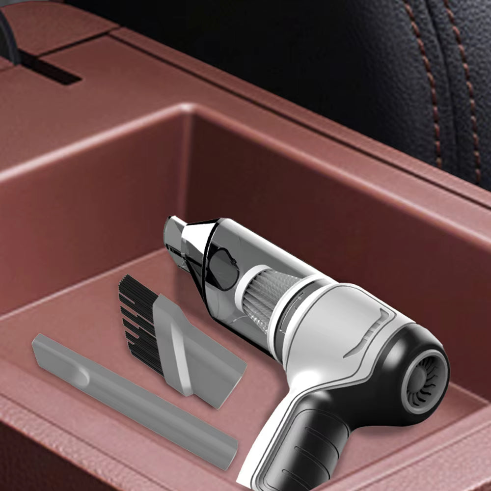mini vacuum cleaner with attachments in a car cup holder