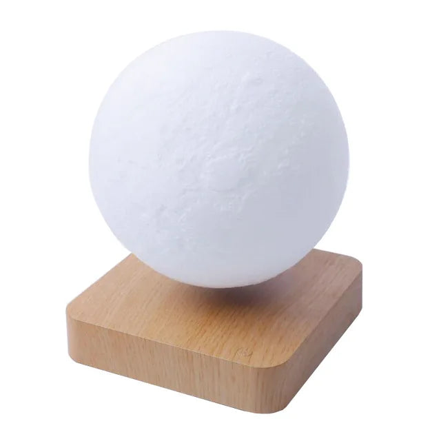 White spherical lamp on a wooden base against a white background