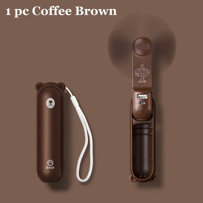 Coffee brown handheld fan with carrying case on a brown background
