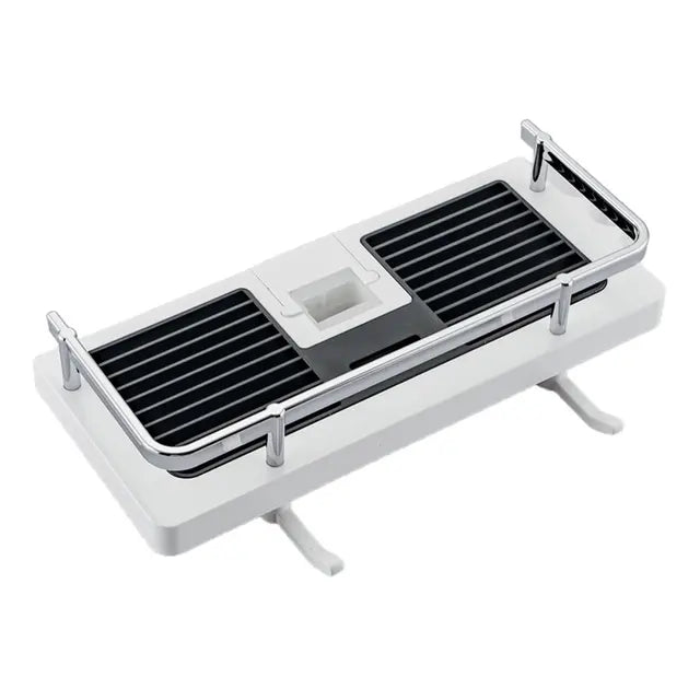 White bathroom shelf with black grid drain on a white background