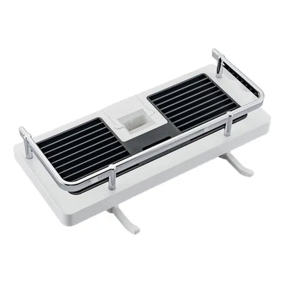 White bathroom shelf with black grid drain on a white background