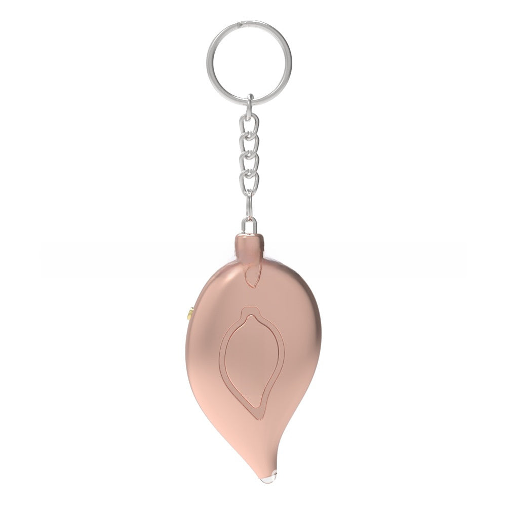 Rose gold SafePulse personal safety alarm keychain