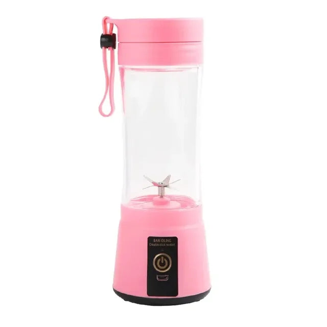 Pink portable blender with clear lid on a white background